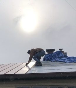 Tim on a job site rooftop